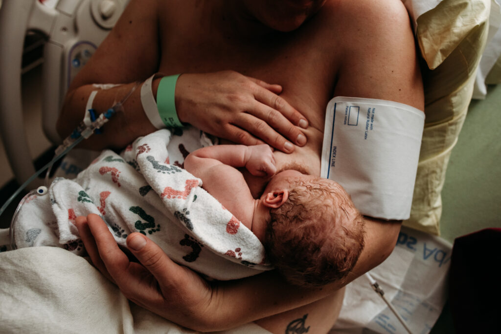 Longmont birth photographer breastfeeding after birth.