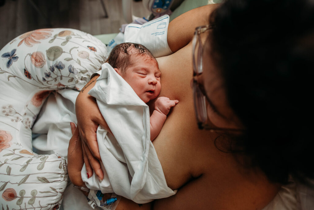 Mom holding brand new baby at Longs Peak Hospital in Longmont CO