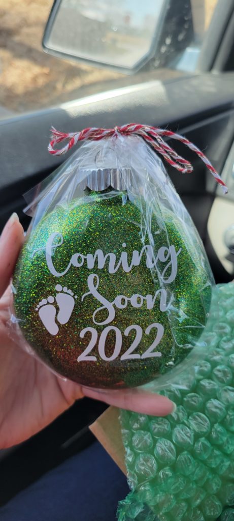 Green Christmas ornament pregnancy announcement "Coming Soon 2022"