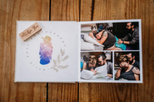 Lay flat album with logo and birth photos from firestone co birth photographer Kylie Bree