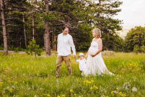 mountain maternity photography. White dress pregnancy photo. wildflower field pregnant photography.