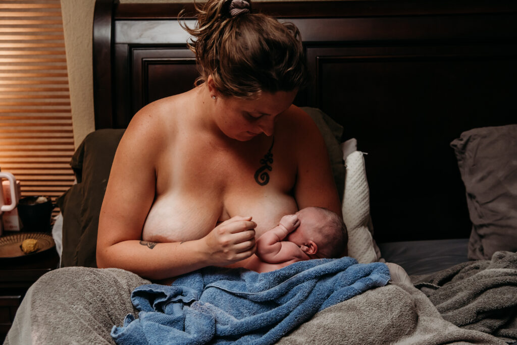 Mom's first time breastfeeding her just born son in her bed in her Johnstown Colorado home.