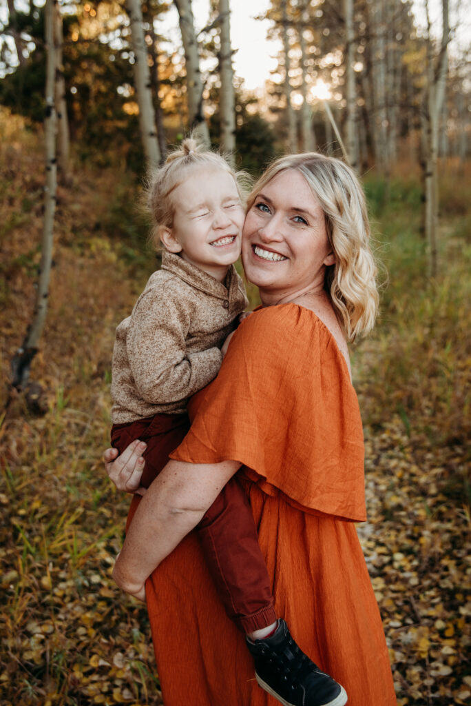 Orange dress family maternity photo with mom and son with Aspen trees in Nederland Colorado