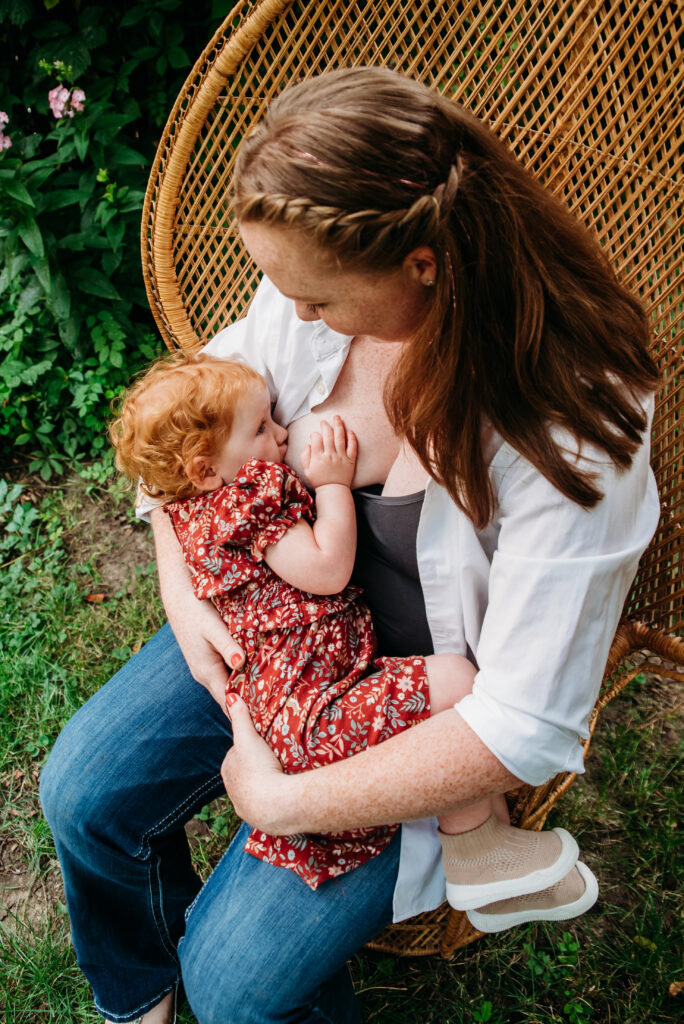 peacock chair breastfeeding photo mom and daughter