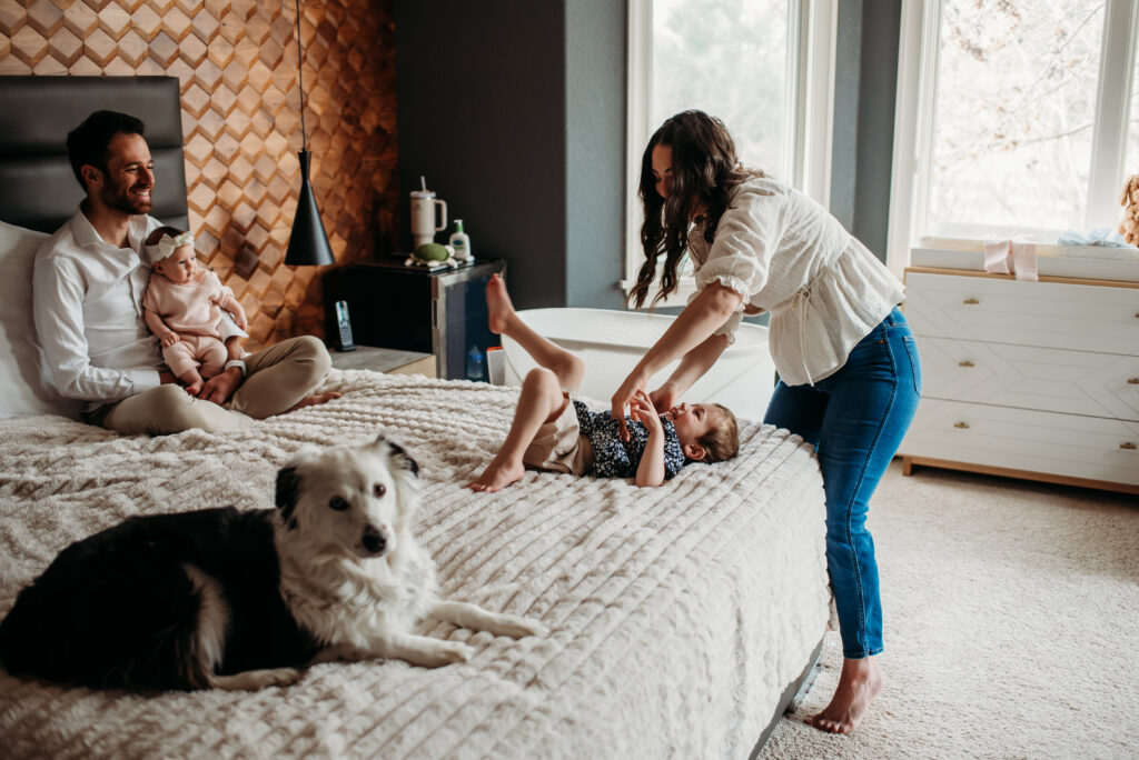 relaxed in home newborn photography session with dog