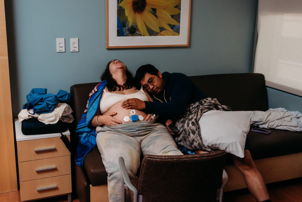 Dad supporting and loving on mom in labor at Children's Hospital in Colorado