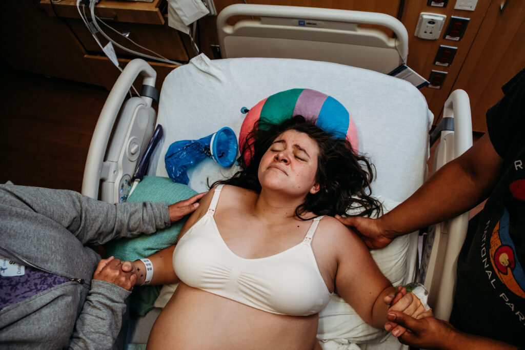 Mom resting between contractions. Birth documentation at Children's Hospital Colorado