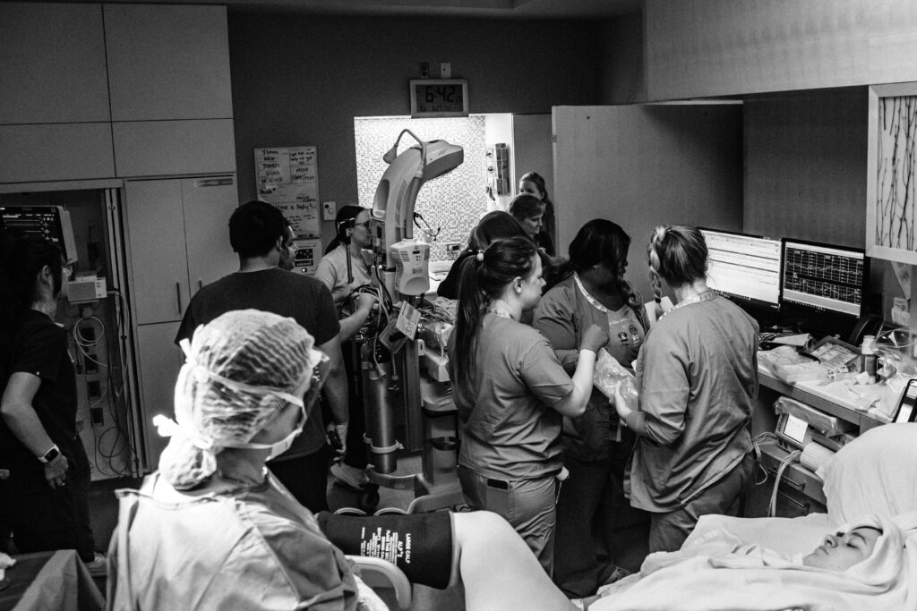 Birth photo of  mom's view while baby gets wheeled to the NICU at Children's Hospital CO