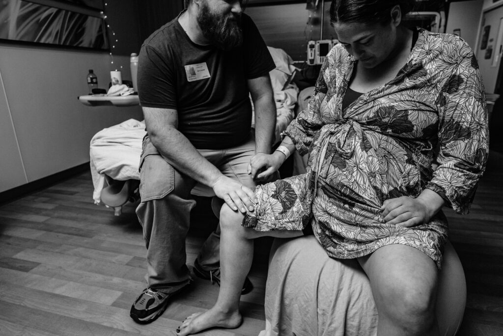 partner supporting birthing mama on birthing ball Longs Peak Hospital