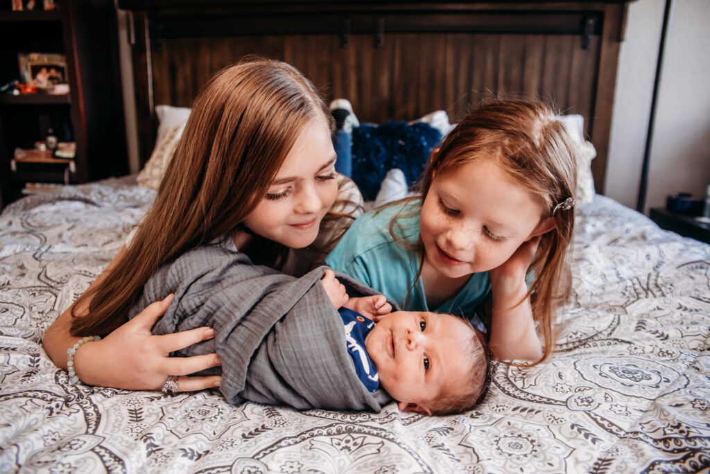 In home siblings with newborn photo
